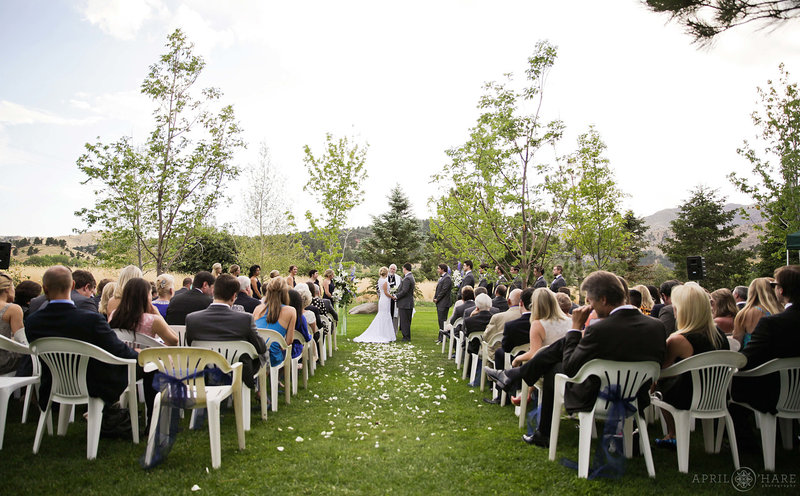 Wide angle view of an outdoor summer wedding on the Cabin Lawn at Greenbriar Inn