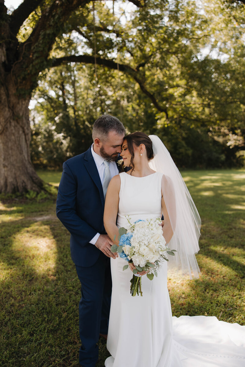 Bride and Groom posed romantically at Dodson Farms
