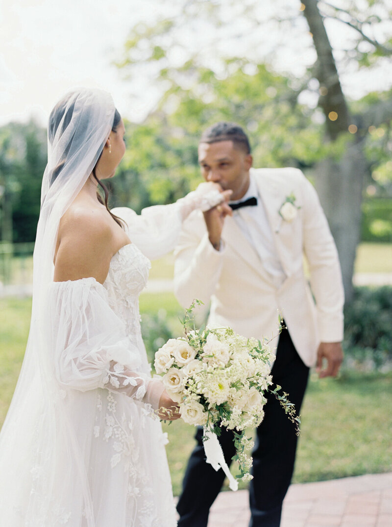 Timeless couple at their European-inspired outdoor wedding in Miami, surrounded by lush gardens and elegant design details.