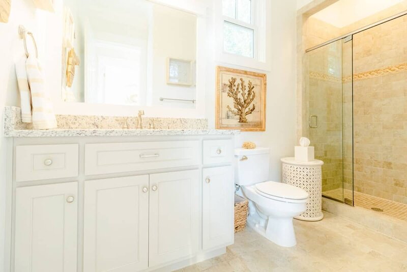 white sink vanity and walk in shower