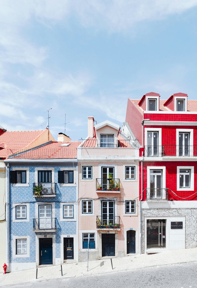 Stock image of colorful row homes with Juliette balconies