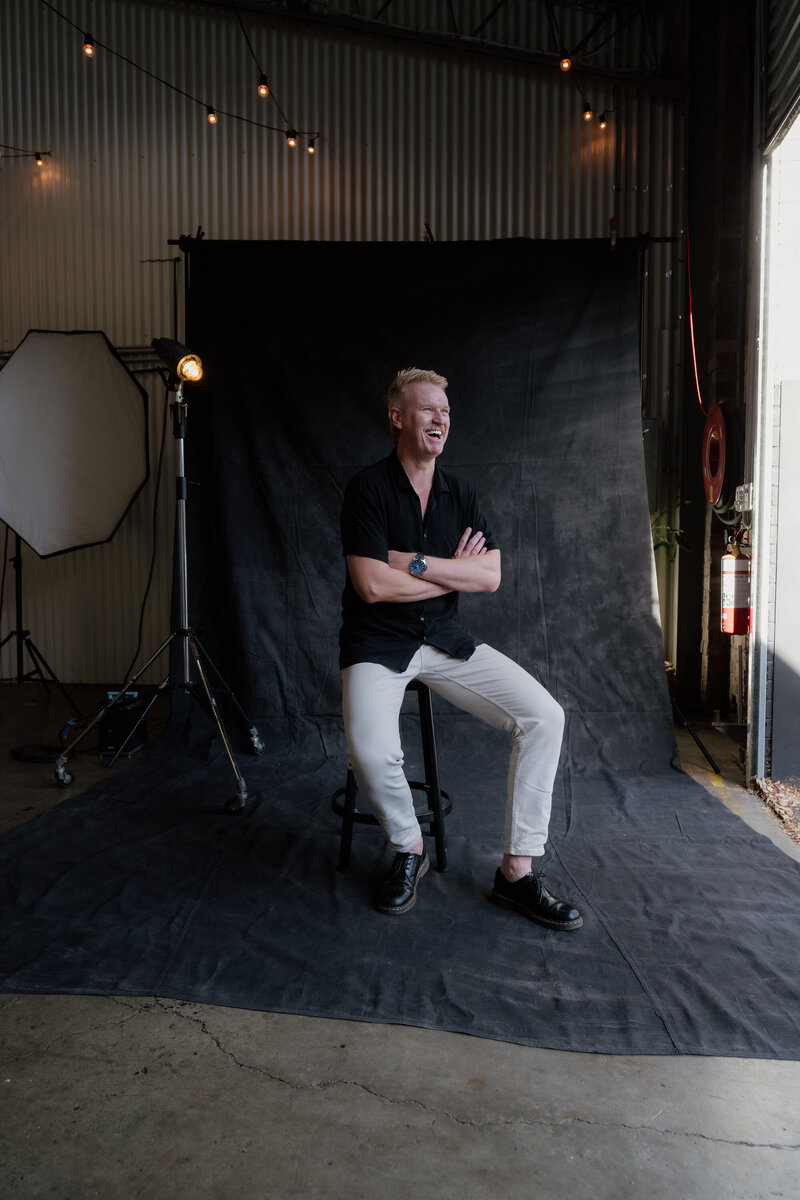 A portrait of Sydney wedding photographer Scott Surplice wearing double denim