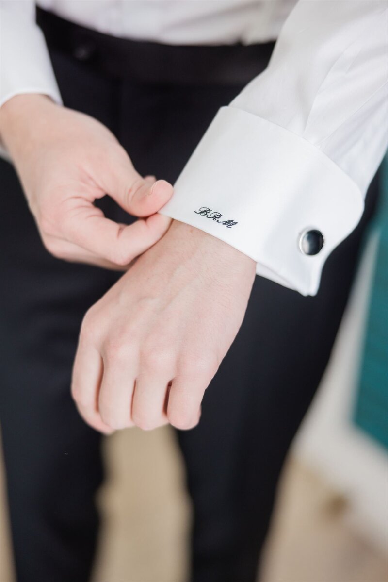 A closeup of a custom groom dress shirt on his wedding day at the Alfond Inn.