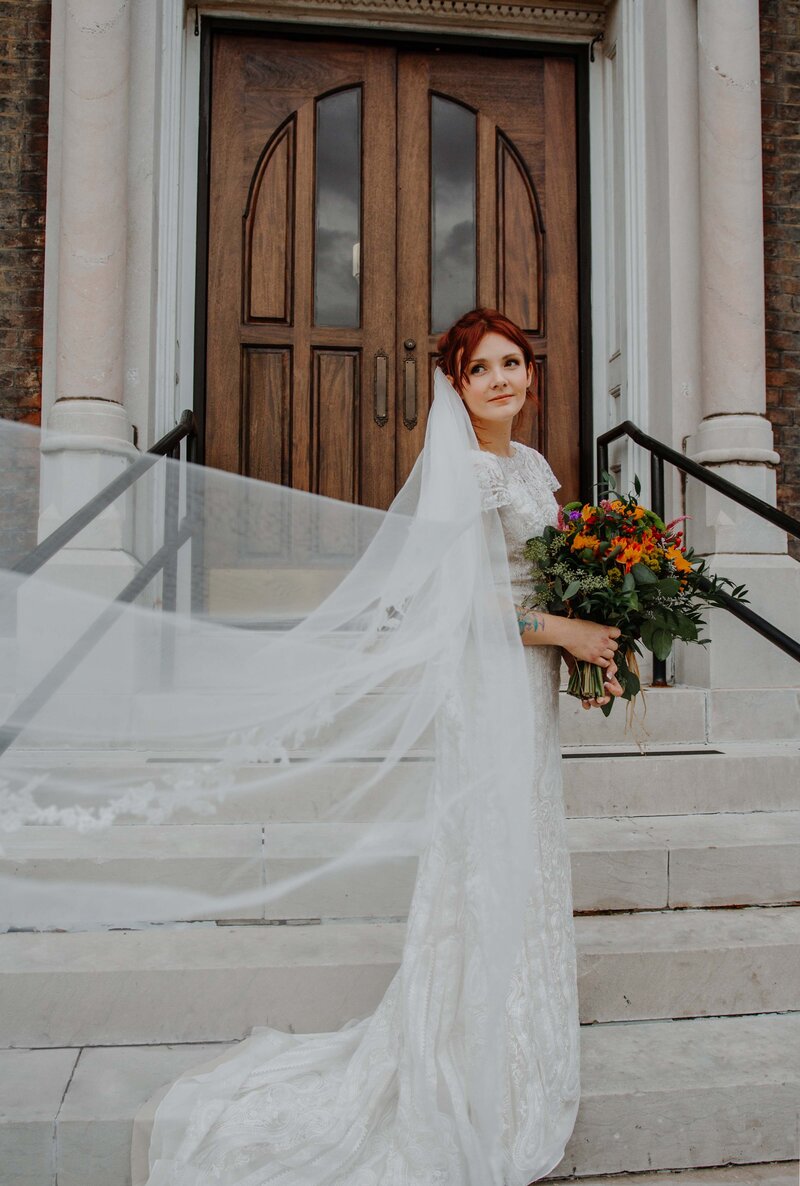 bride in white dress and long veil