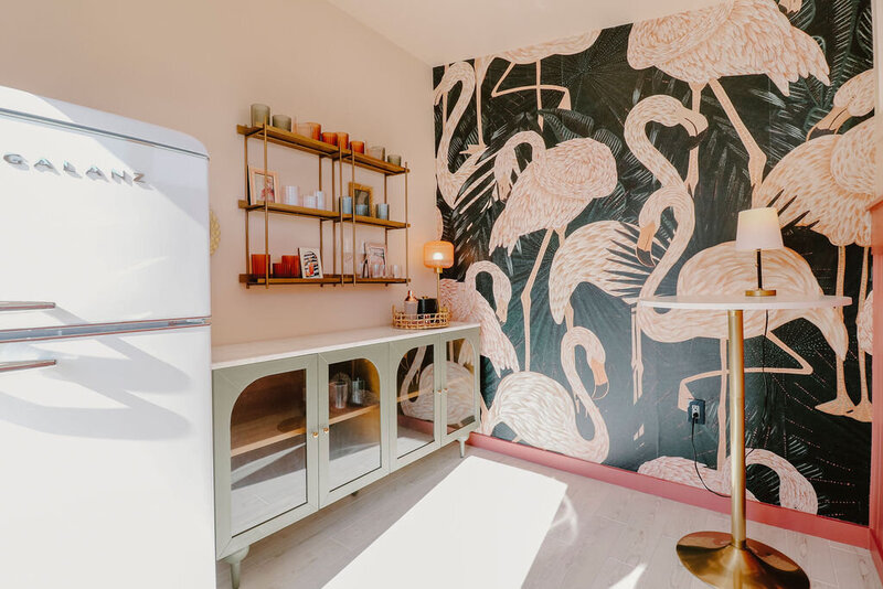 flamingo wallpaper, green credenza with glass doors, white refrigerator