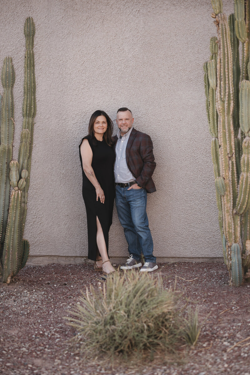 Matthew and Luisia Kidwell standing against a wall smiling near cacti - Vertical - Finance and Communication Coaching at Kidwell Coaching and Consulting 20