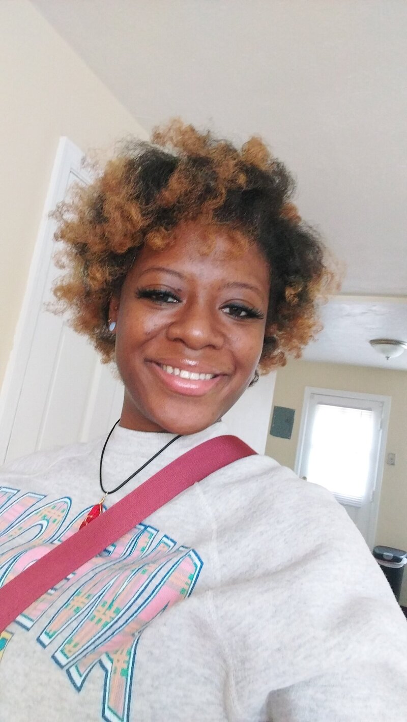 Portrait of a confident Me & She Doula professional.