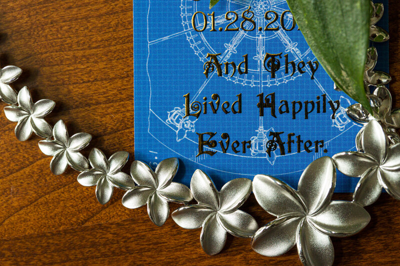 Close-up of a wedding necklace with the quote 'They lived happily ever after,' capturing a magical Disney wedding detail.