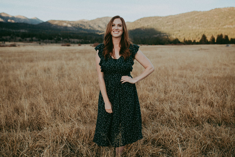 woman wearing dress and smiling