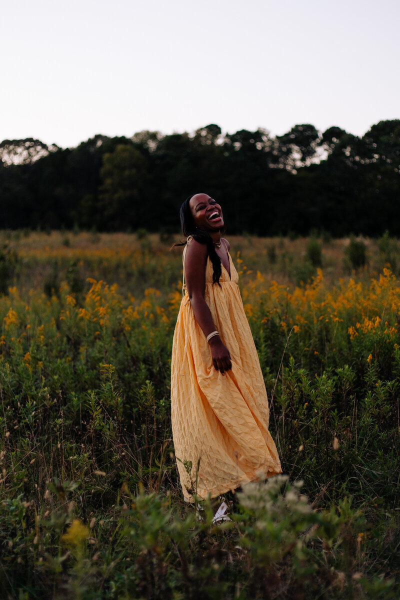 Girl laughing in Field