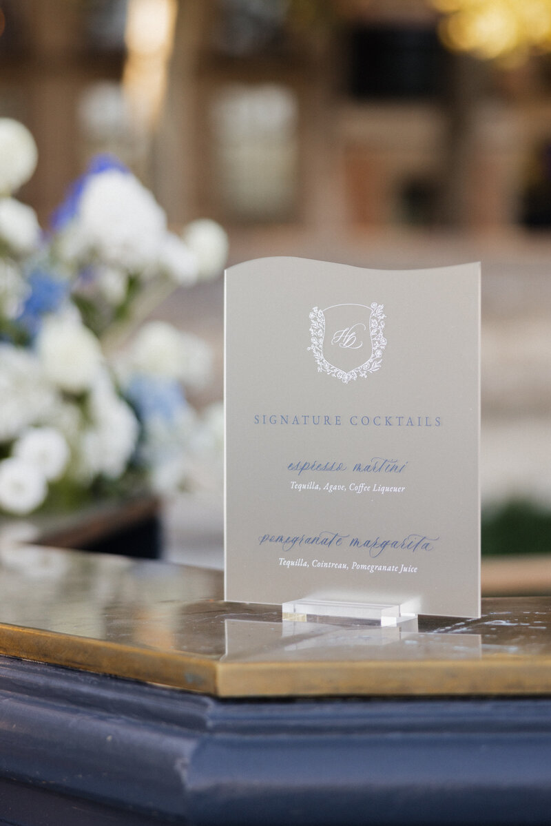 Custom signage with calligraphy and a custom crest