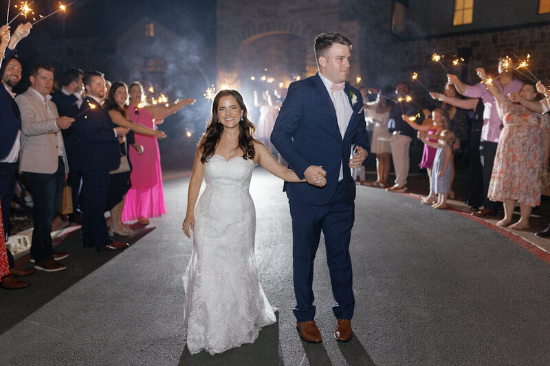 Bride and groom’s grand exit from Canyonwood Ridge reception hall