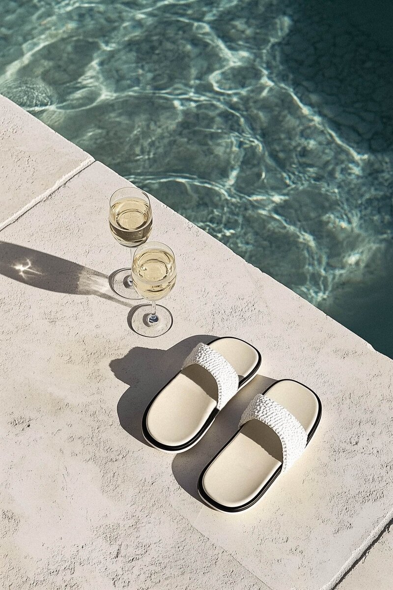 Pam sitting at her desk in front of a window writing out a podcast strategy plan