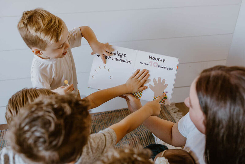 babysitter teaching numbers to children