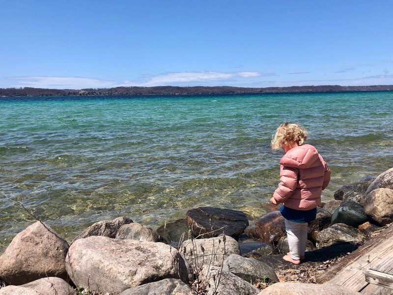Looking for rocks at lakeshore