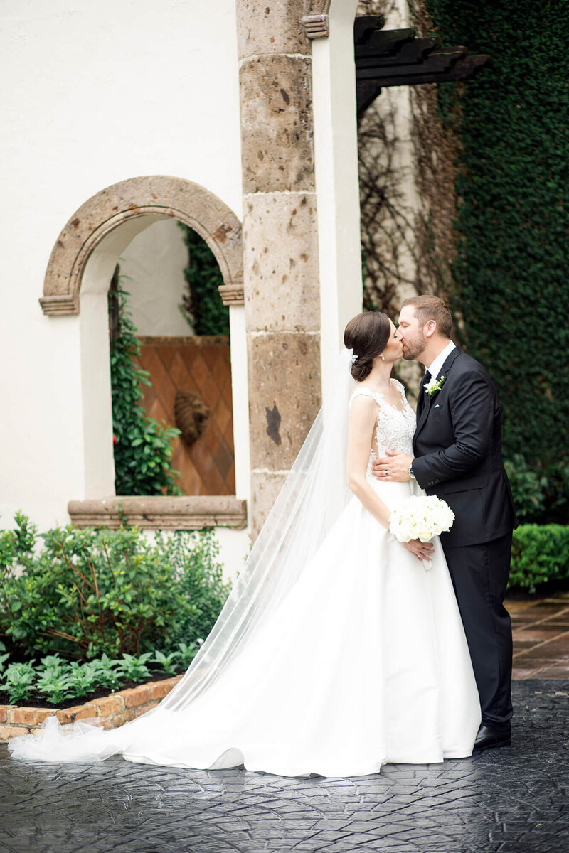wedding kisses captured by Houston wedding photographer Swish and Click Photography at the Bell Tower on 34th
