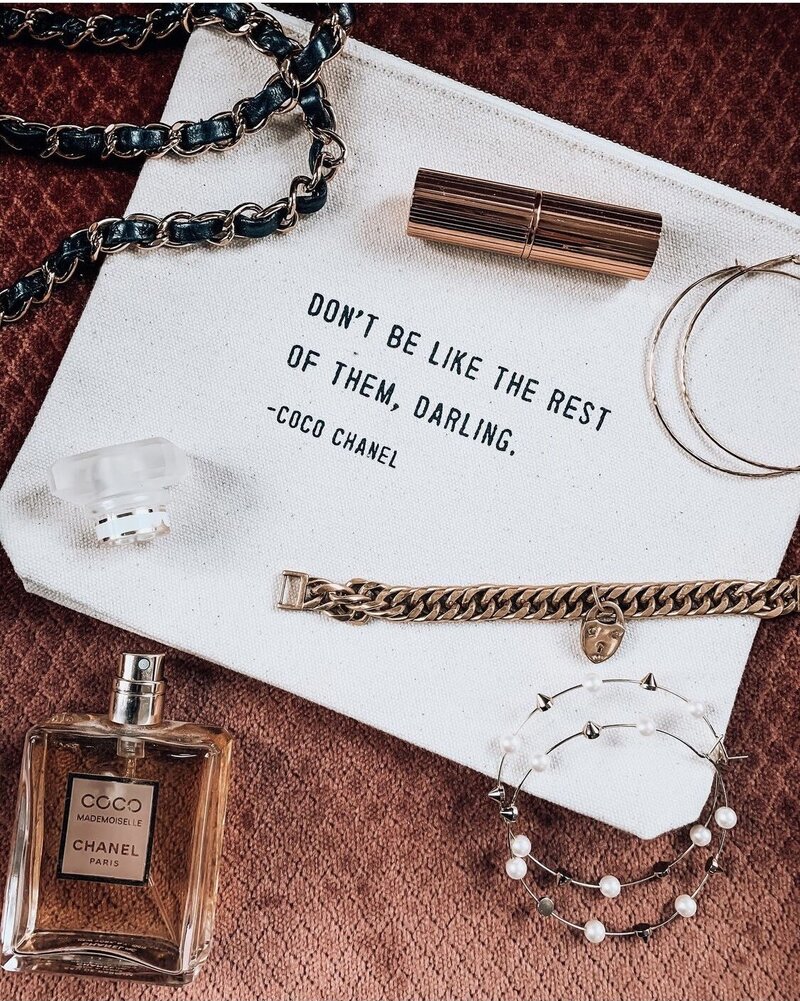 Coco Chanel Beauty Bag with Coco Chanel perfume and jewelry including earrings, bracelets and lipstick. Photo by AMALYN STYLE + SOCIAL 
