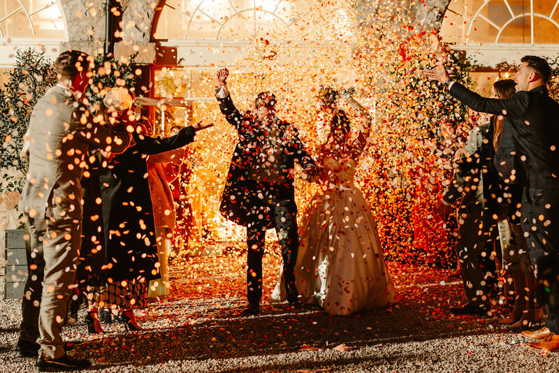 bride and bridal party in silk gowns sitting in bath drinking champagne fun alternative wedding photographer scotland