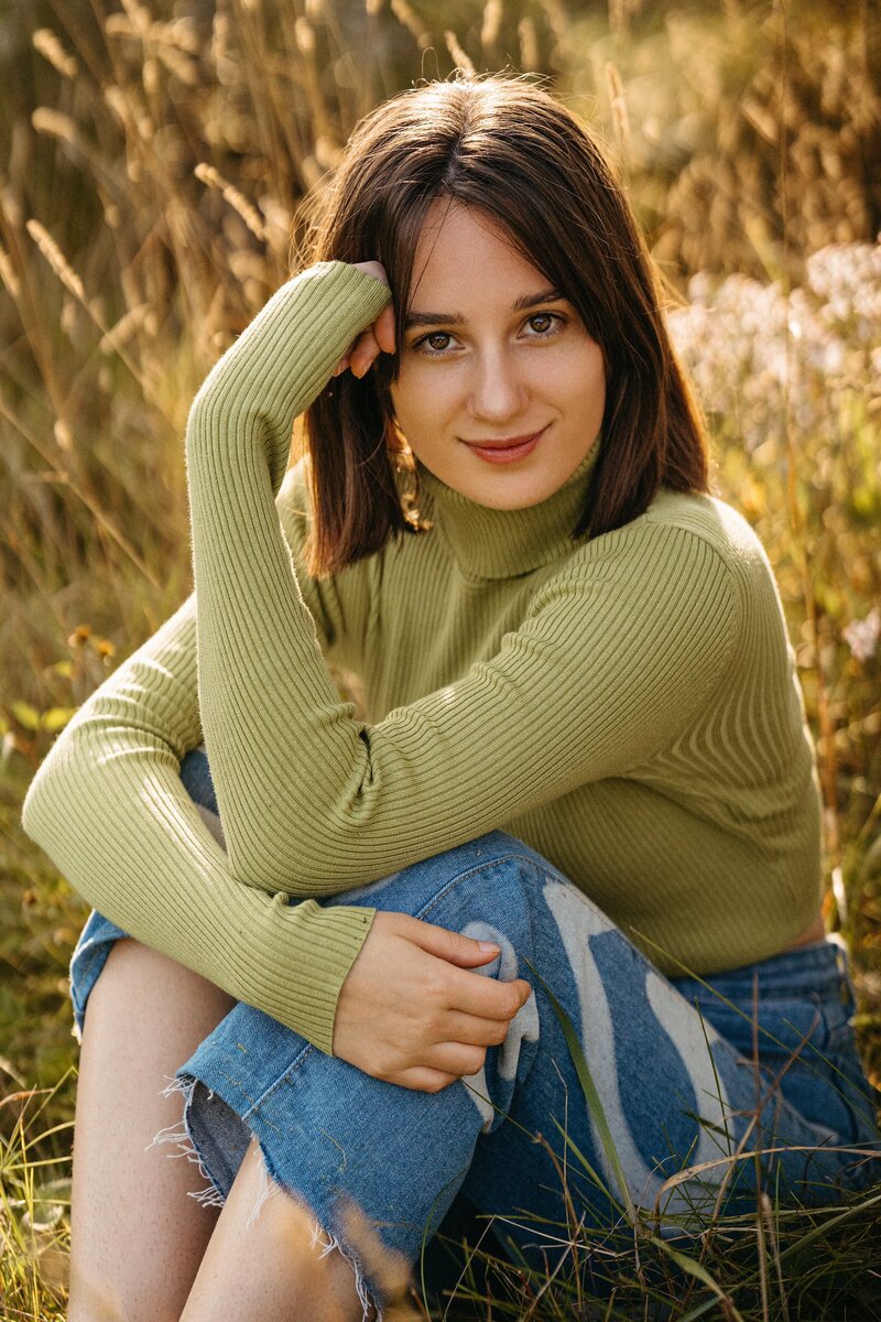 Golden hour portrait of a woman, soft light illuminating her face