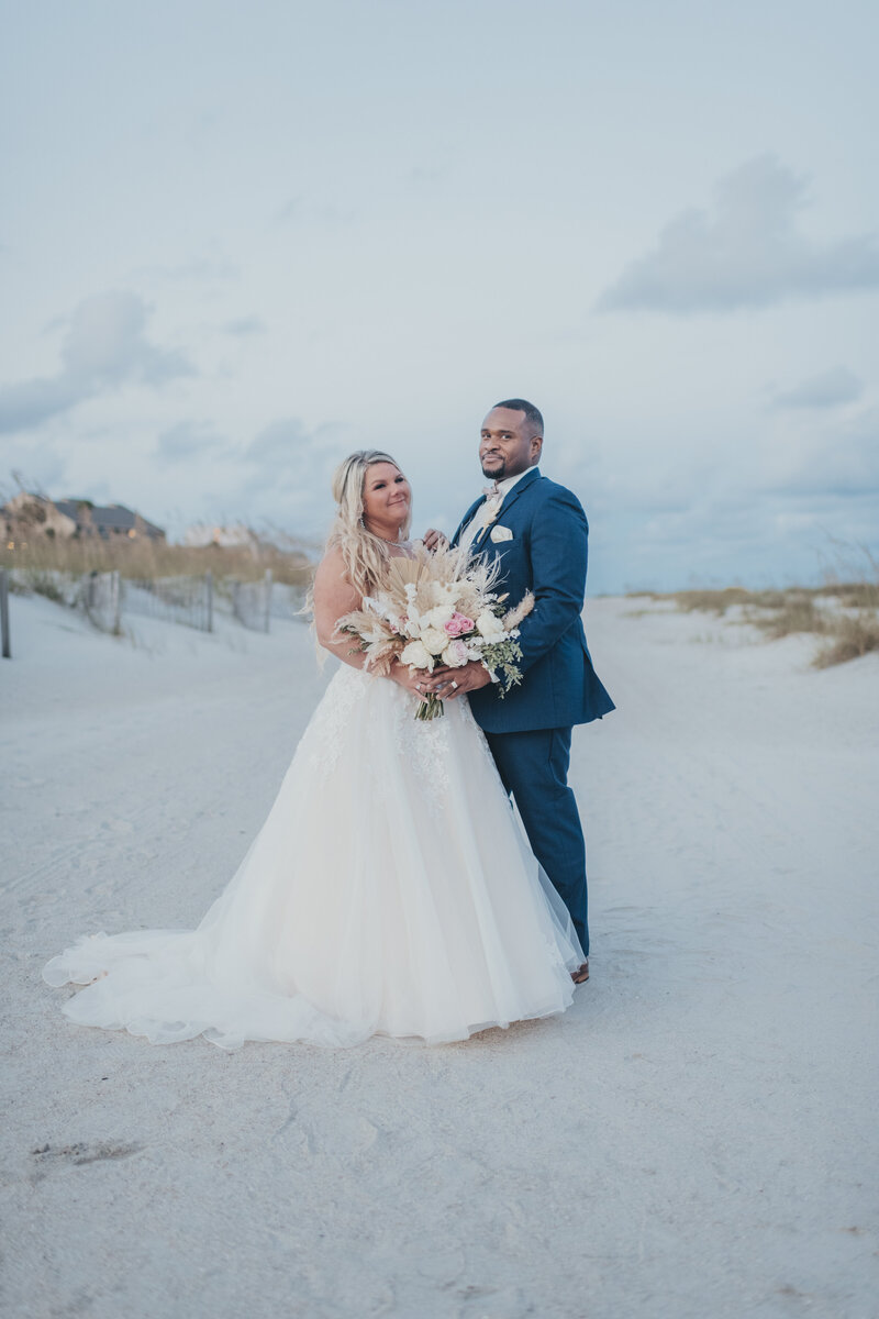 bride and groom on the beach at omni resort hilton head wedding