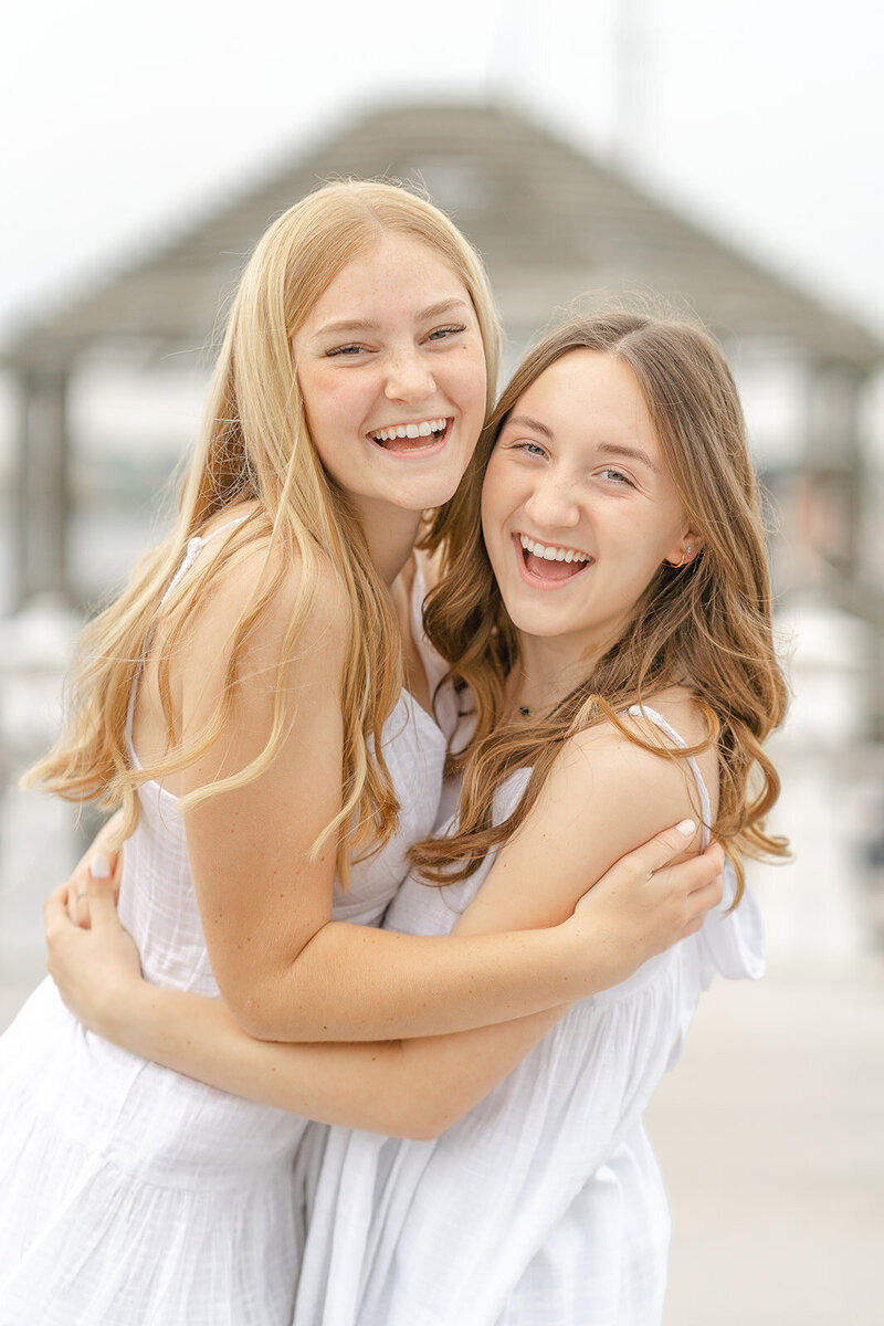 sisters laughing during Northern VA senior photography