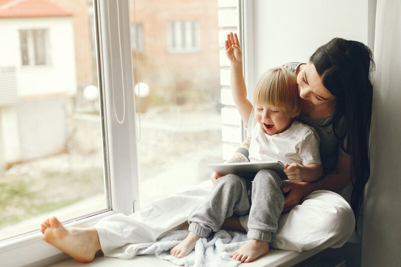 mother-little-son-sitting-windowsill