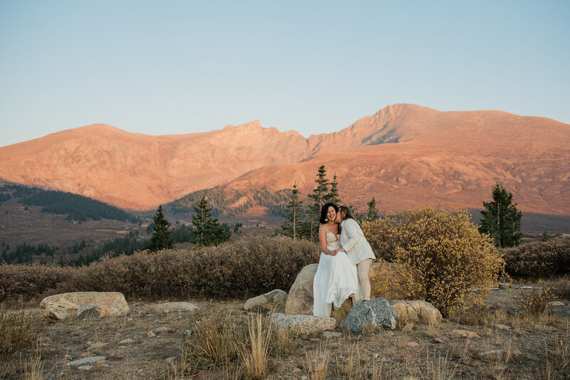 LGBTQ+ couple kisses during their mountain elopement at Guanella Pass in Colorado