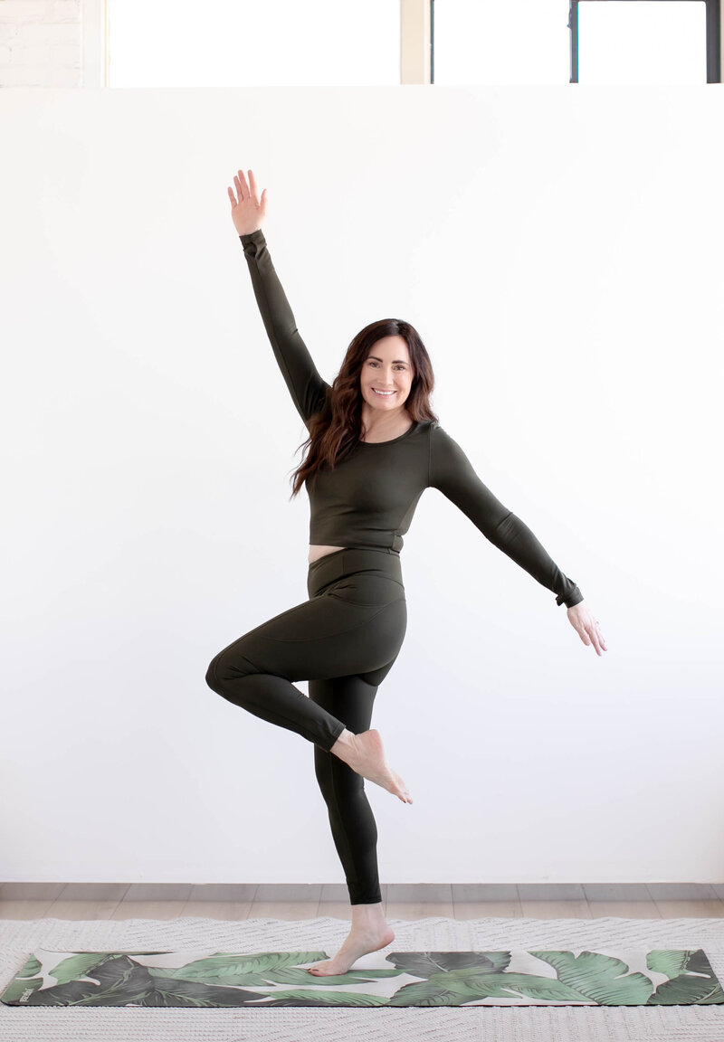 Woman with arms raised, skipping with a sense of happiness and freedom