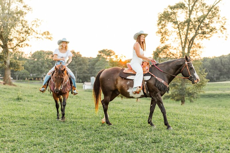 two sisters riding horses together