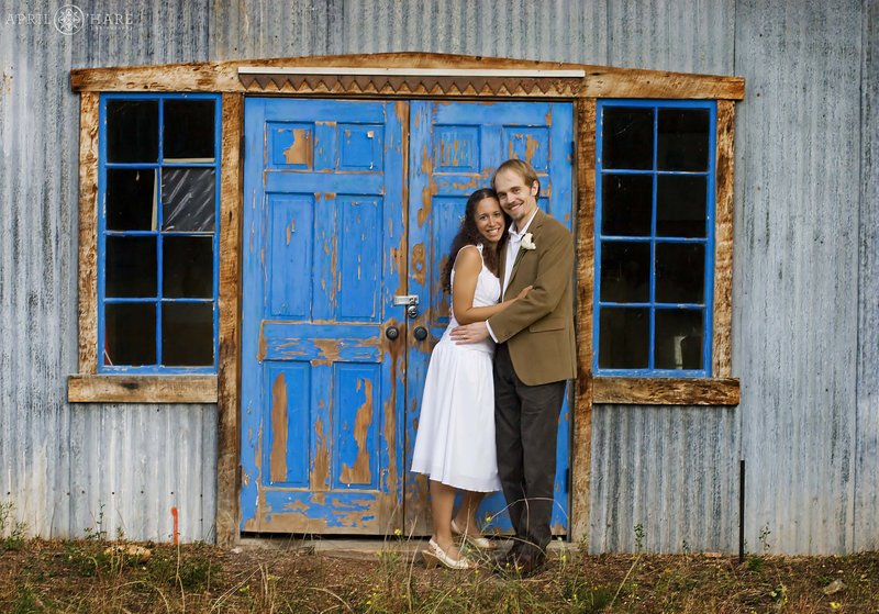 Rancho Manzana wedding photo with bright colors on blue door with peeling paint at Rancho Manzana in New Mexico