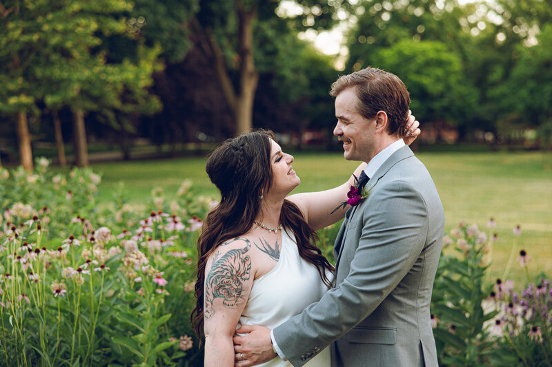 A couple share a private moment on their wedding day at Pleasant Home in Oak Park