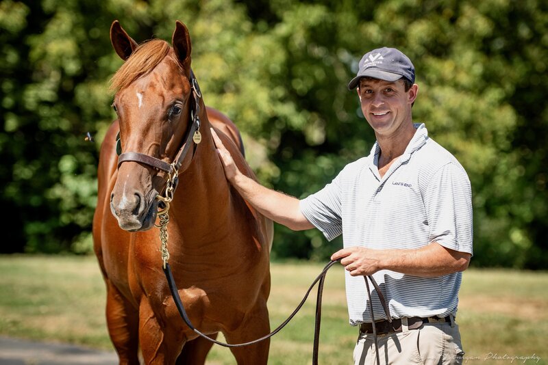 Headley VanMeter with a Thoroughbred horse.
