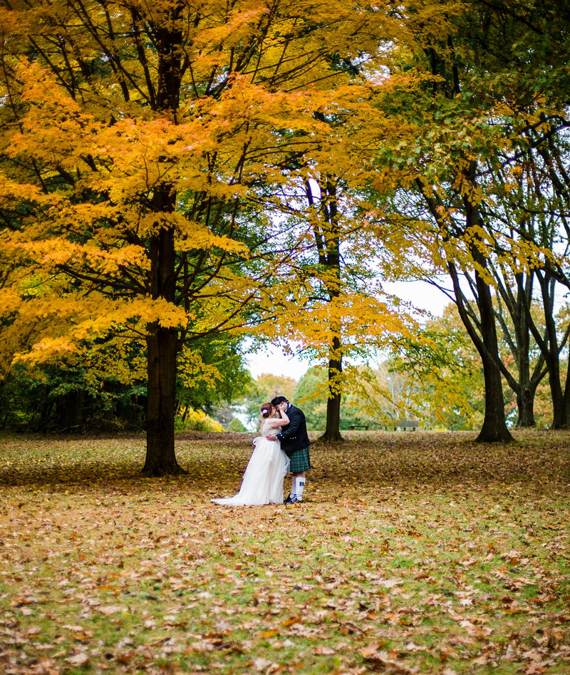 Groom rests head on bride's shoulder at Majestic Woods wedding