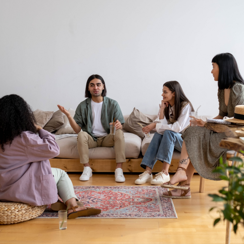 Friends sitting in living room 