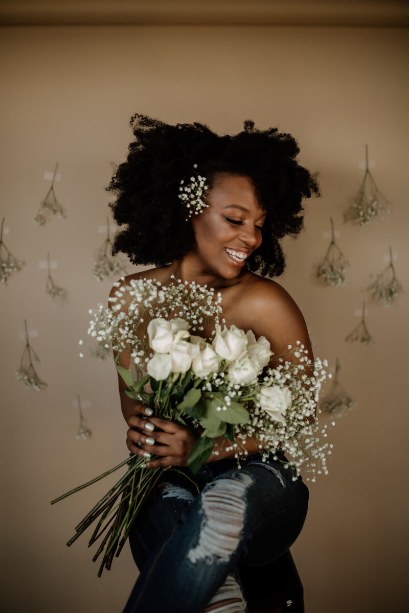 woman smiling with flowers