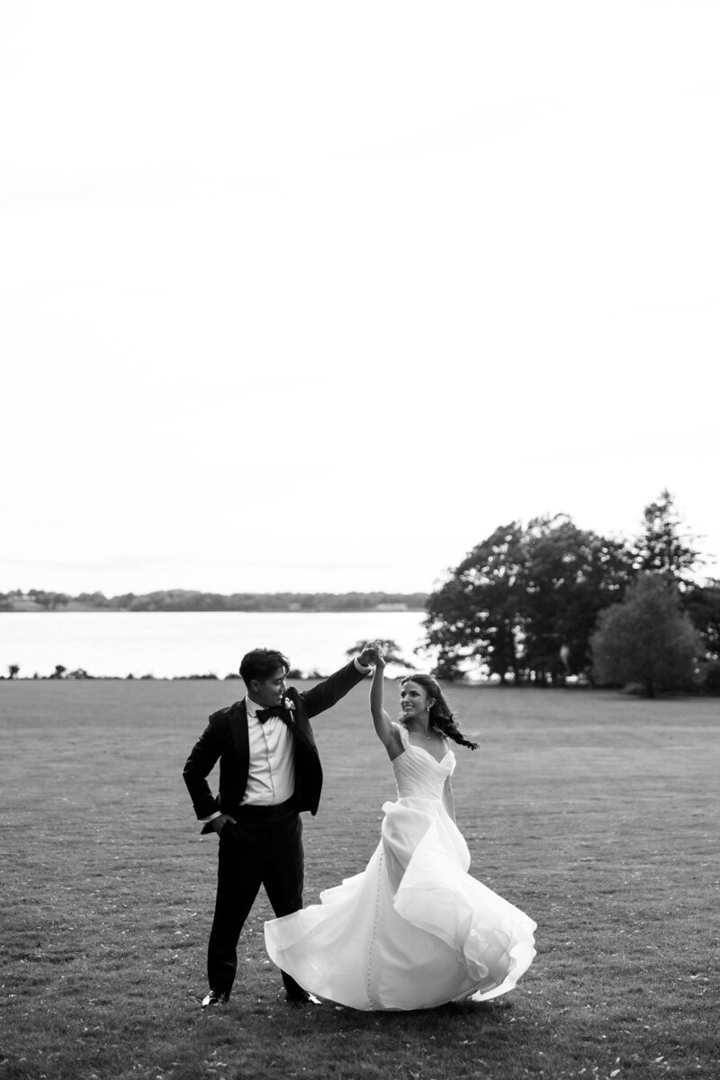 Candid wedding moment of Bride twirling in her wedding dress