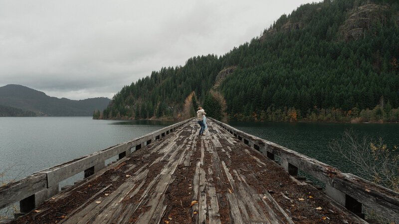 Couple on a trestle bridge in Campbell River during their engagement session by latitude 49 photography
