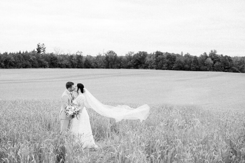 Outdoor wedding in Ottawa with a brides veil in the wind