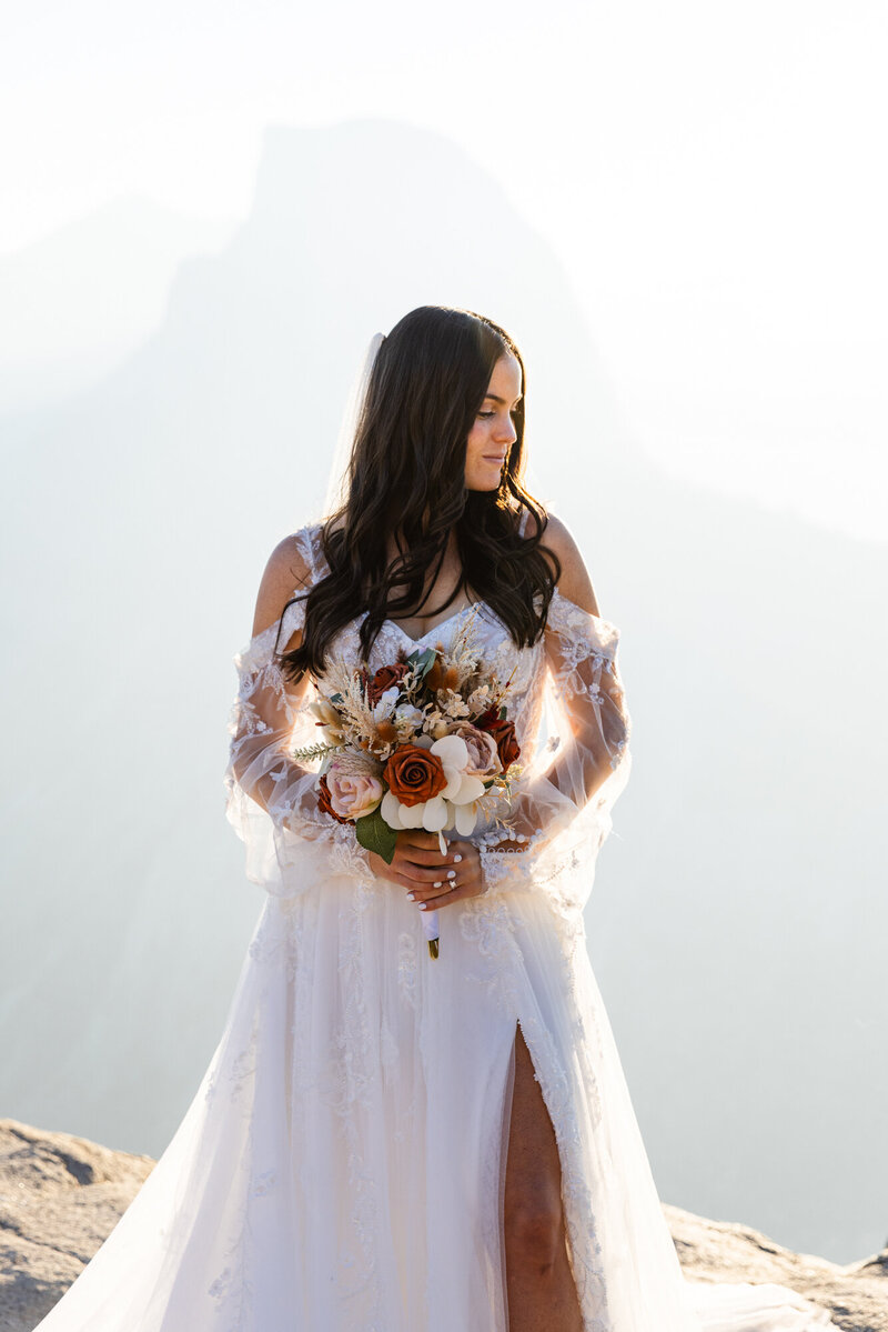groom holding up bride
