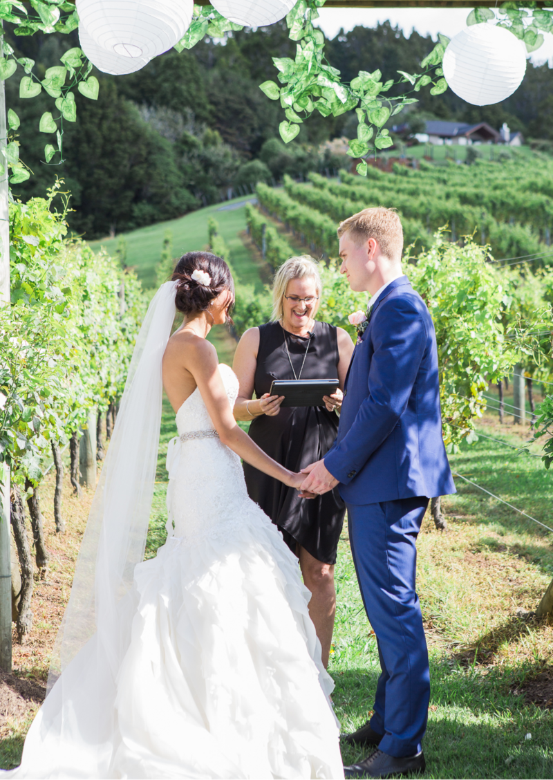 Lush vineyard ceremony surrounded by wine country views