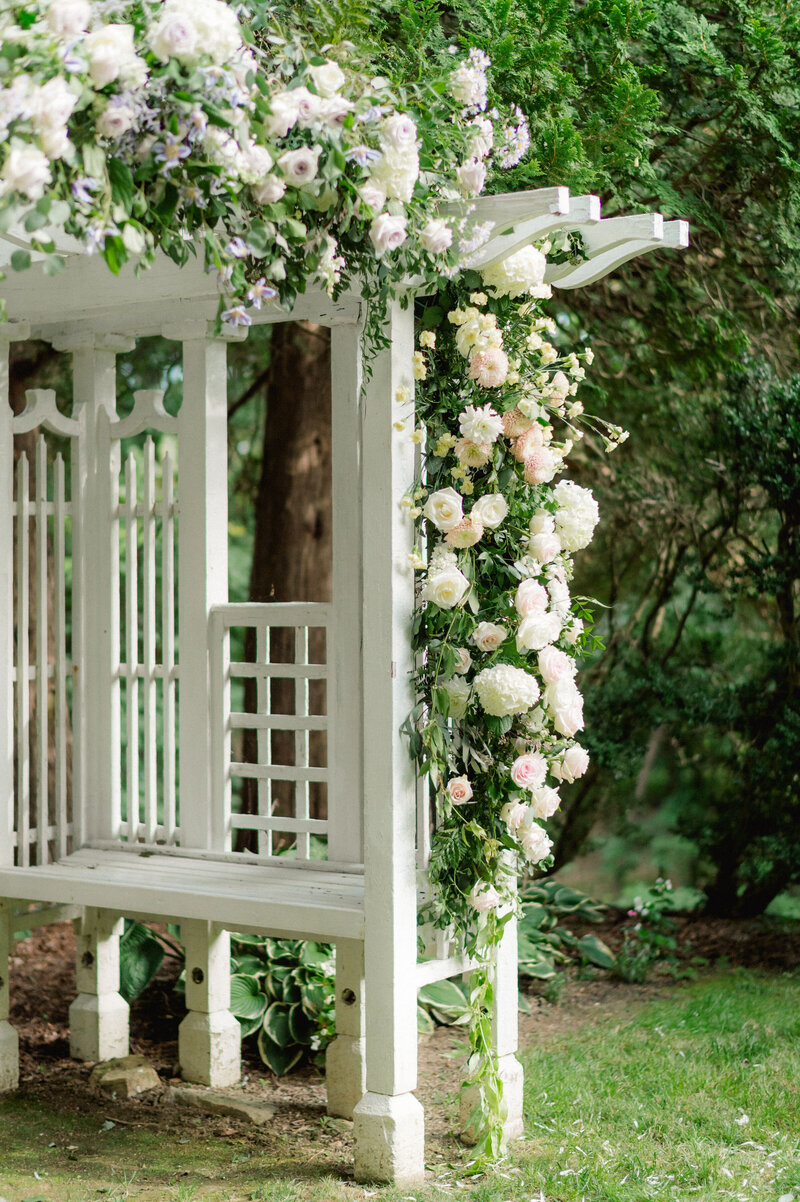 Garden blooms over a trellis. Custom floral design by The Garden Studio LLC, an Easton, MD florist.