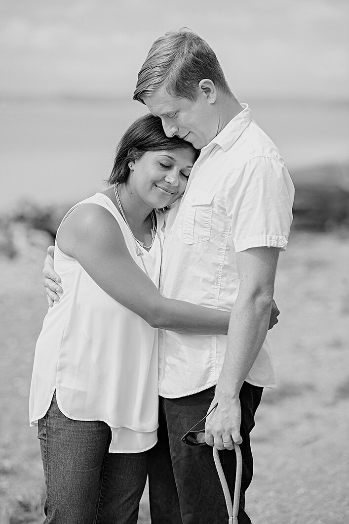 Black and white photo of a couple hugging.