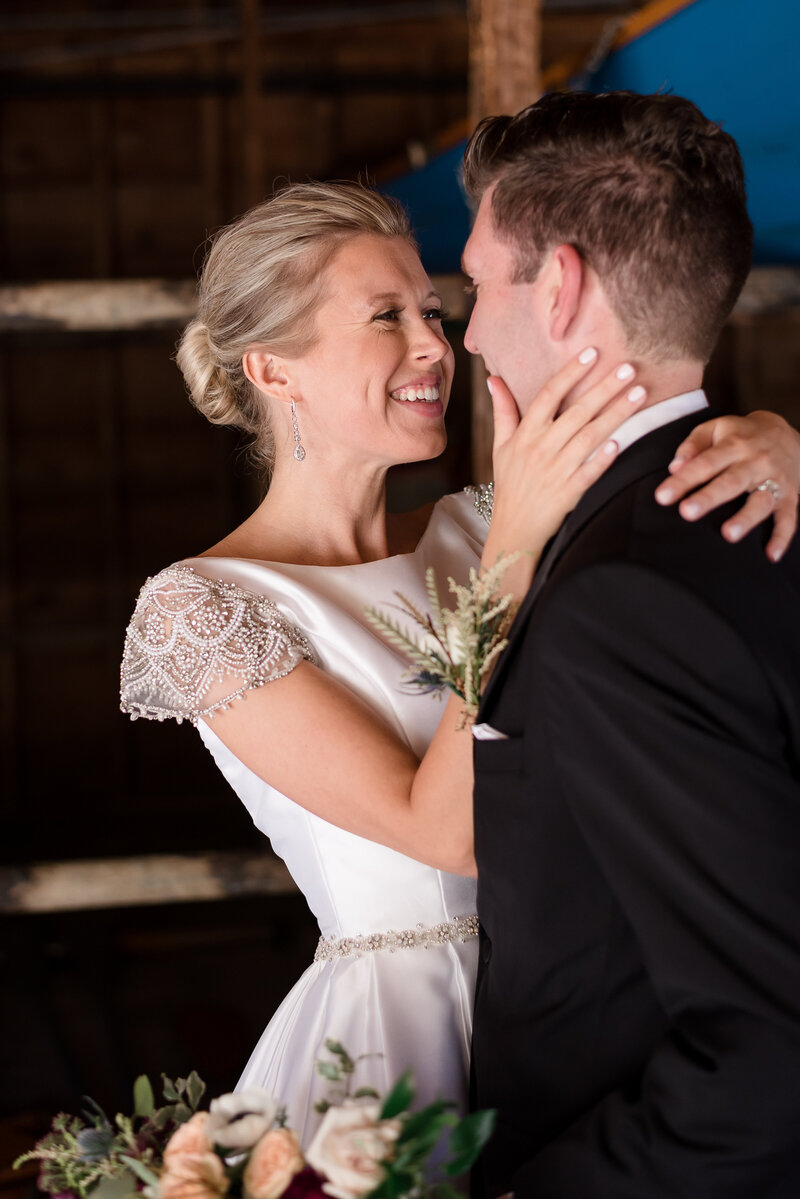 photo of bride looking at groom at her ausable club wedding in the adirondacks