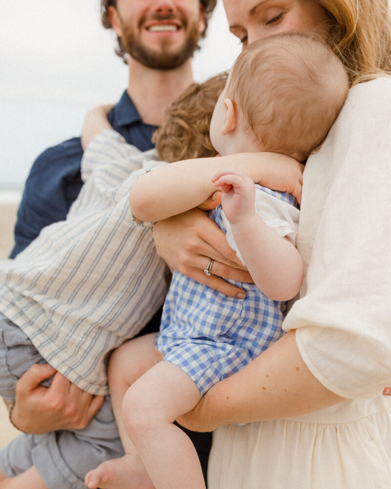professional beach family  photo shoot , taken by Emily DeLuke Photography in Surf City  North Carolina
