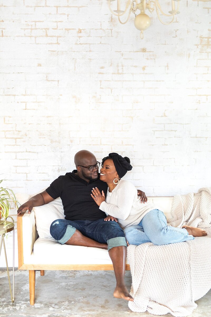 Glen & Yvette Henry snuggled on the couch. | How Married Are You?!