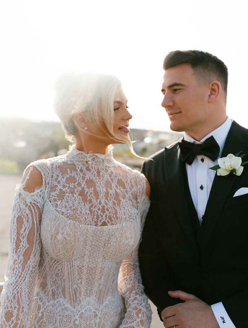 Couple sharing a joyful moment in a Charleston historic district.
