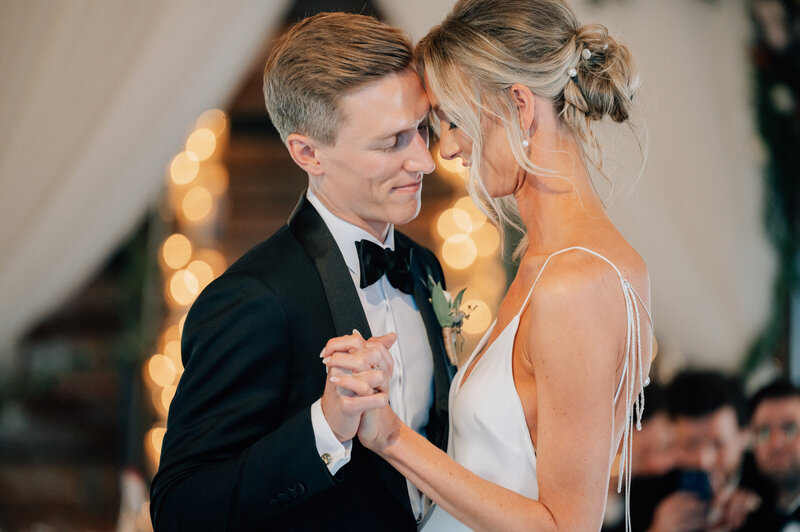 Bride and Groom share a first dance at The River Center. Photo by Anna Brace - a team of Des Moines wedding photographers.