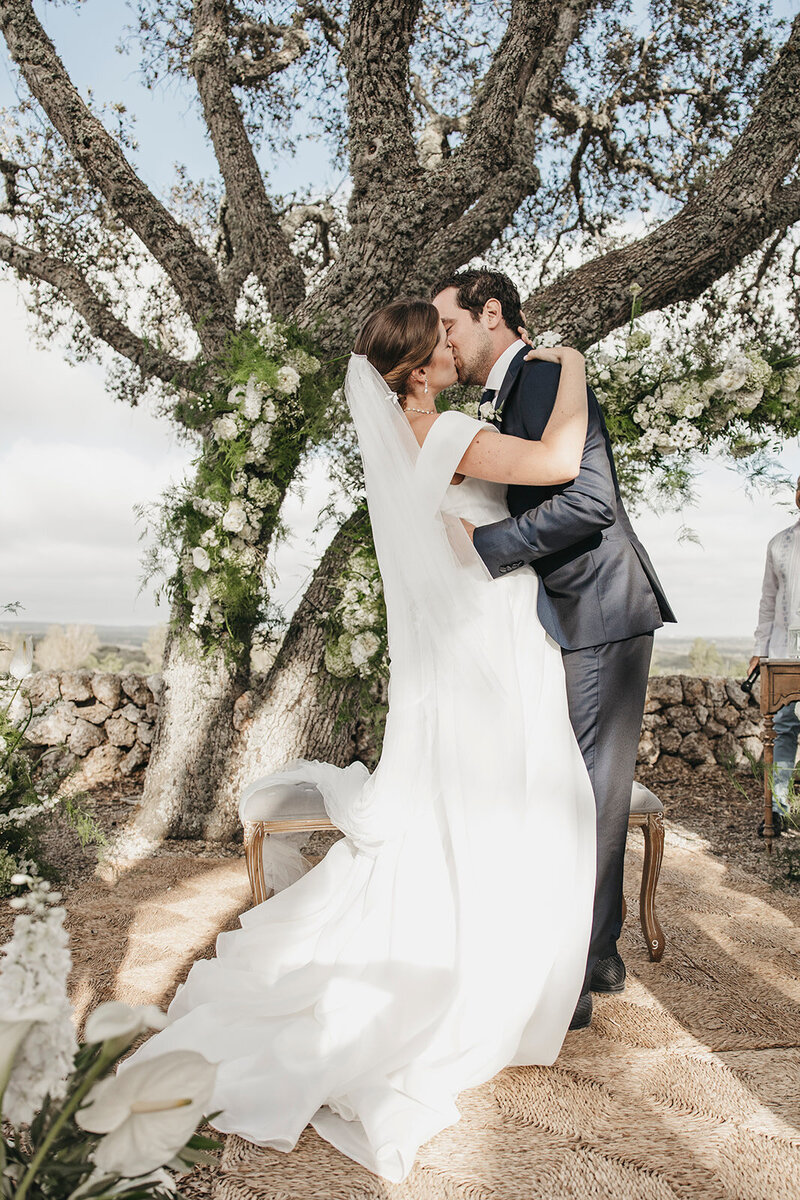 bride and groom kiss