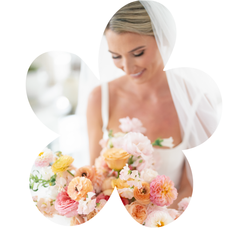 Bold red and blush wedding floral arrangement with a disco ball accent, styled for a modern Austin corporate event or vibrant wedding celebration.
