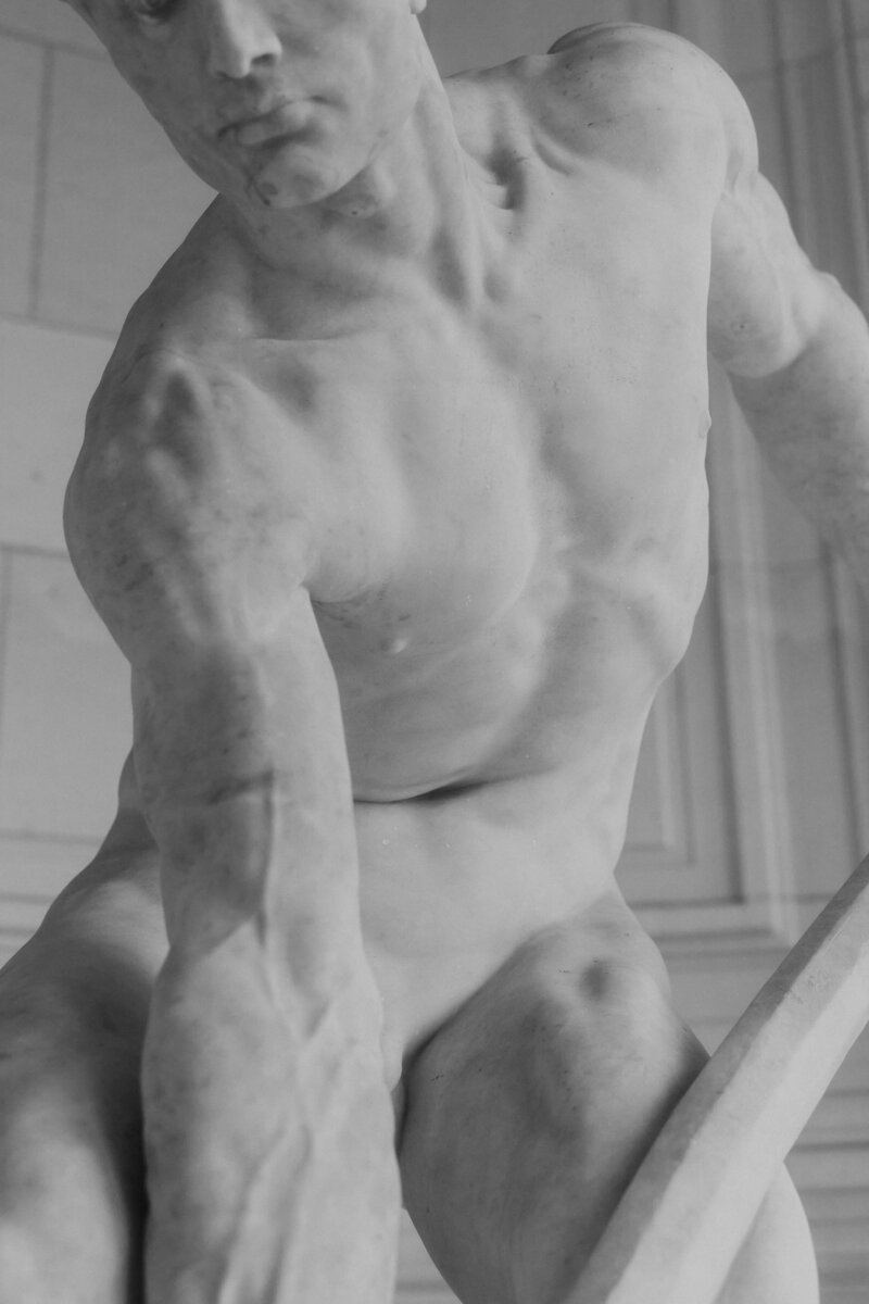 Elegant engagement detail in Palais Royal garden in Paris